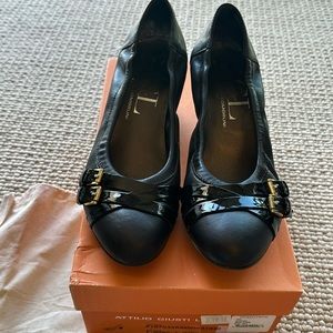 Black leather short pumps. Lightly worn.